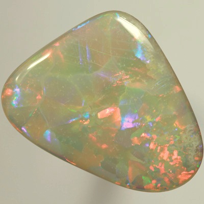 SOLID SEMI BLACK OPAL  Huge opal. Very bright fire, Flagstone Harlequin pattern. Top quality. SEE VIDEO